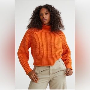 H&M orange knit sweater.